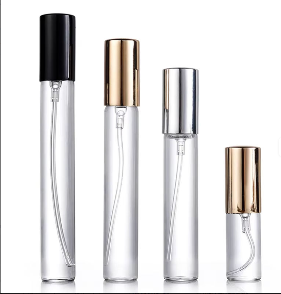 Set of clear perfume bottles with various colored caps on a white background