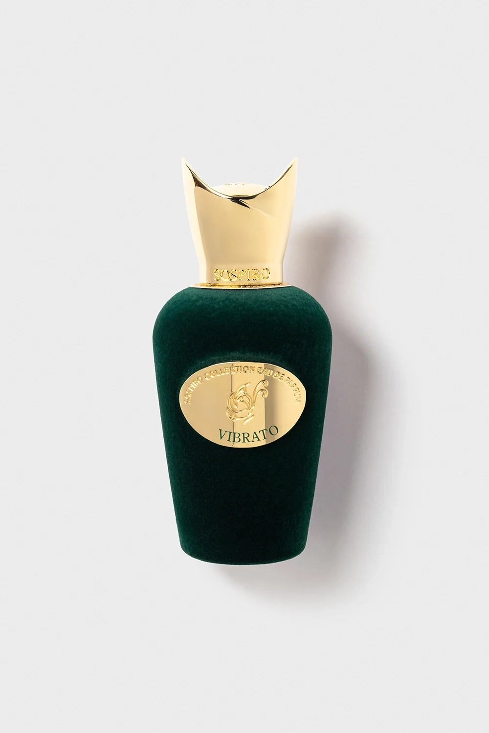 Green perfume bottle with gold cap on a white background