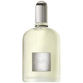 Perfume bottle with silver cap and label on a white background