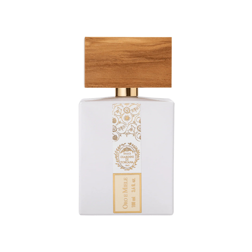 Perfume bottle with wooden cap on a white background